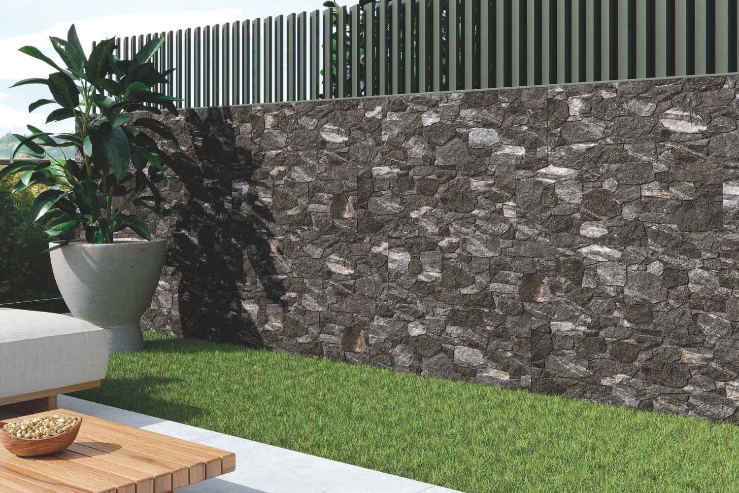 Verblender Steinoptik Anthrazit aus Feinsteinzeug an einer modernen Gartenmauer im Außenbereich
