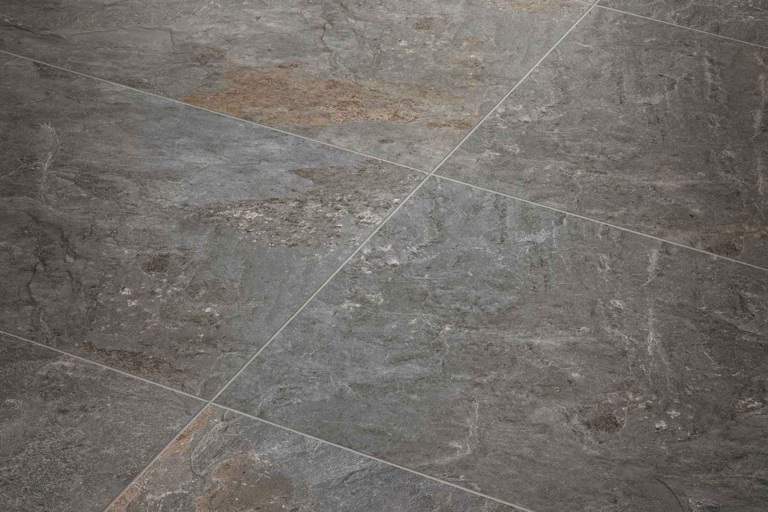 Monocibec Dolomite Grey mit grauer Natursteinstruktur und warmen braunen Nuancen